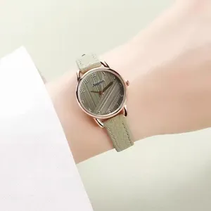 Minimalist women's watch with olive green leather strap and rose gold round metal case