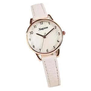 Minimalist women's quartz watch with rose gold case, white leather strap and numeric dial