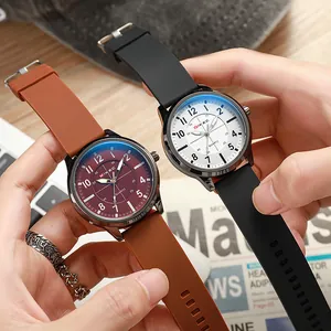 Detail shot of two quartz watches with silicone straps and large dial for men
