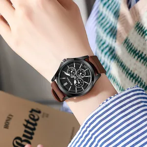 Close-up of a BARSH men's quartz watch with a black dial and dark brown strap on a wrist