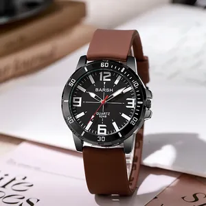 Detail of trendy sports watch featuring a black dial and a brown silicone strap