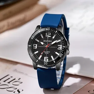 Detail of blue silicone strap and black sport watch dial with luminous hands
