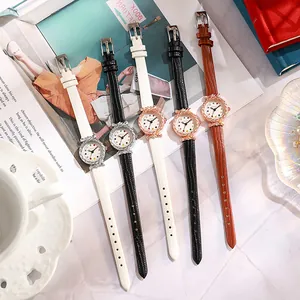 Elegant women round quartz watches with leather straps and bowknot accents in three colors