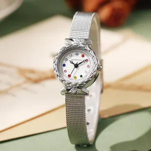 Elegant silver mesh strap ladies watch with colorful gemstone markers and a round white dial