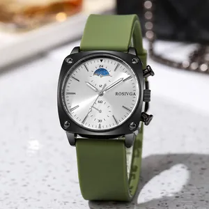 Detail of square black steel watch with olive green strap and sun-moon dial features