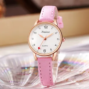 Detail of rose gold watch case with pink glitter strap and red heart second hand