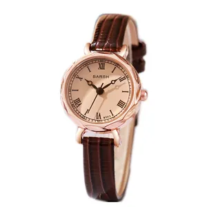 Orologio analogico elegante da donna con cassa oro rosa, quadrante champagne e pelle marrone