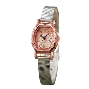 Elegant ladies horseshoe watch with rose gold case and silver mesh strap on white background