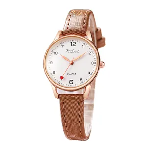 Minimalist women's quartz watch with rose gold case and brown shimmering strap