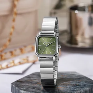 Detailed close-up of a square ladies' watch with a green sunray dial and silver steel band