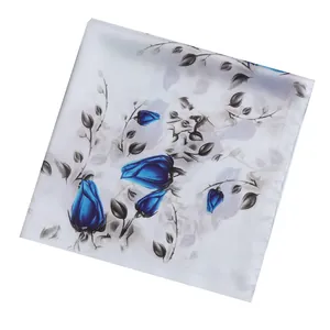 Minimalist square silk scarf featuring blue rose floral print on a white satin background