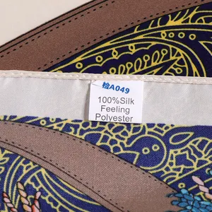 Detailed macro view of the machine-rolled hem and high-density silk-like polyester fabric