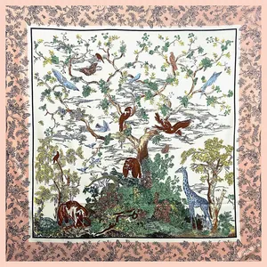 Detailed close-up of a twill silk scarf with forest animals and tree patterns