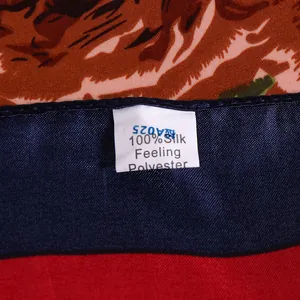 Detail shot of the 100% silk feeling polyester material label on the rose scarf