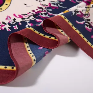 Close-up of vintage paisley silk scarf with rolled edges and elegant satin texture