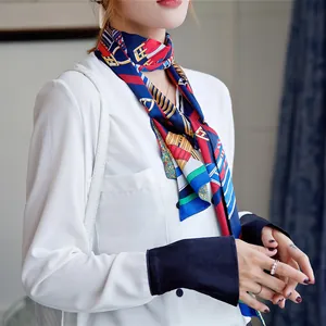 Close-up of geometric belt print twilly scarf tied around neck for elegant styling
