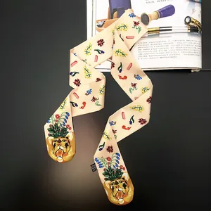 Off-white silk Twilly scarf featuring cartoon tiger and floral prints on black background