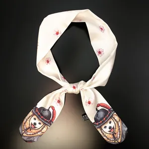 Detail shot of white twilly scarf featuring cute Shiba Inu and cherry blossom prints