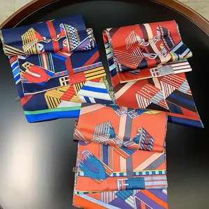 Detail of silk scarves with equestrian patterns including stirrups and leather belts