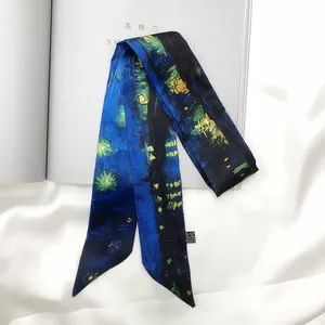 Detail shot of van gogh starry night silk twilly scarf on elegant white background