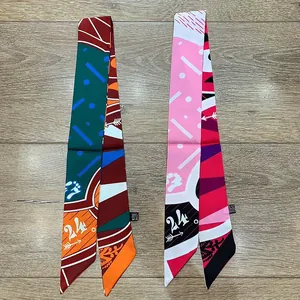 Detail of geometric twilly silk scarves with number 24 print and material wash label