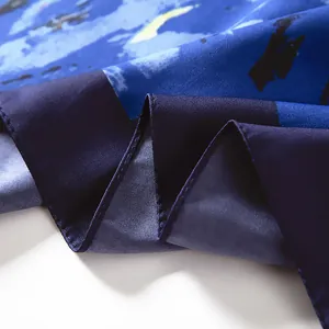 Macro shot of Van Gogh Starry Night silk scarf with elegant rolled hem edges