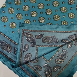 Teal paisley satin silk square scarf featuring star geometric patterns and rolled edges