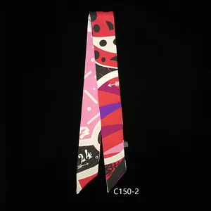 Macro detail of geometric pattern twilly scarf with bold colors and diagonal cut ends
