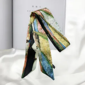 Close-up of artistic oil painting print silk twilly scarf with elegant brand tag