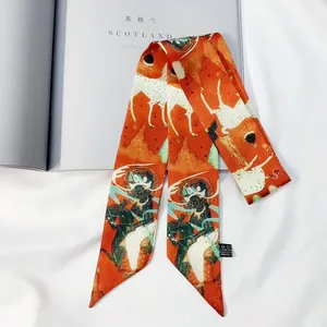Artistic twilly scarf with oriental patterns of deer and figures on orange-red fabric