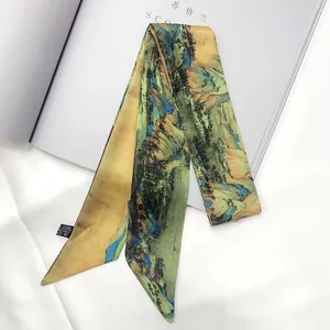Close-up of a twilly silk scarf featuring traditional Chinese landscape ink painting
