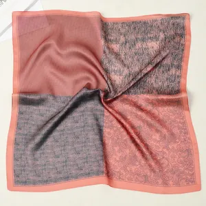 53cm coral pink and grey silk scarf with patchwork paisley patterns on a plain surface