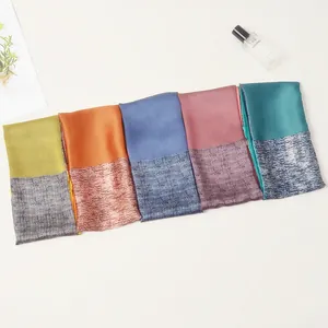 Detailed overhead view of five colorful 53cm silk scarves with striped patterns