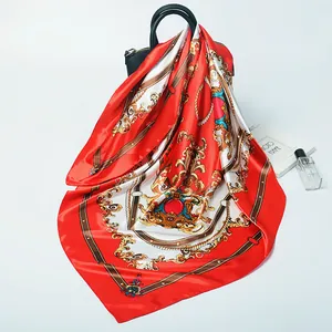 Baroque royal gemstone pattern silk scarf draped elegantly over a black luxury handbag