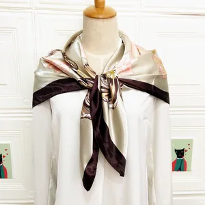 Detail of elegant 90cm floral silk scarf with tulip pattern on a fashion mannequin