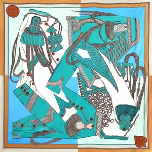 Detail of silk square scarf featuring royal ropes, tassels and turquoise color block