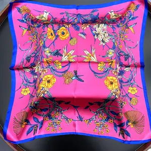 Silk-like square scarf with floral prints and birds in pink and navy blue border
