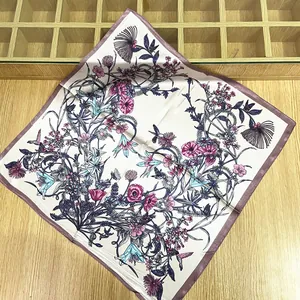 Detail of 60cm square silk scarf with floral botanical prints and hummingbird pattern