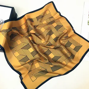 Ginger yellow silk square scarf with black geometric lines and satin finish texture