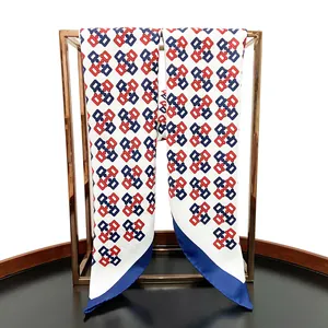 Detailed shot of hand-rolled edges on twill silk scarf with chain link pattern