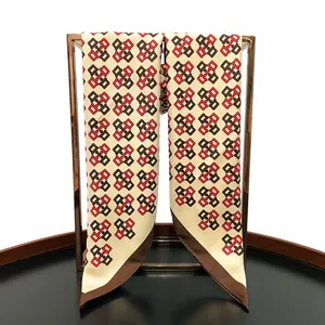 Detail of 90cm twill silk scarf with interlocking geometric patterns and hand-rolled edges