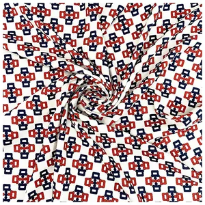 Detail of 90cm silk scarf showing hand-rolled edges and geometric chain pattern