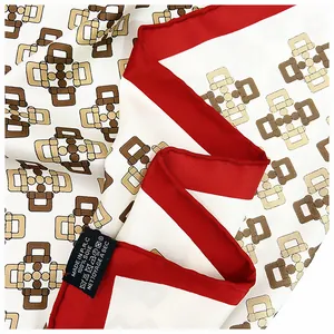 Detail of 100% silk twill scarf with hand-rolled edges and equestrian pattern