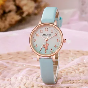 Detailed close-up of cute cat motif on light blue leather strap wristwatch for women