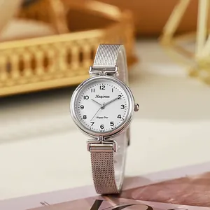 Close-up of women's silver Milanese mesh strap watch with a white Arabic numeral dial