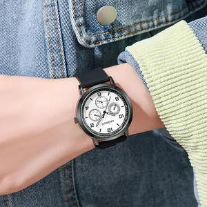 Minimalist quartz wristwatch with black alloy case and white dial worn on the wrist
