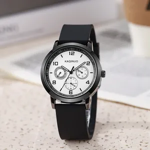 Close-up of quartz watch with white triple-subdial face and black silicone strap