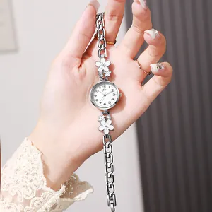 Elegant silver quartz watch with white petal-shaped links and diamond accents for women