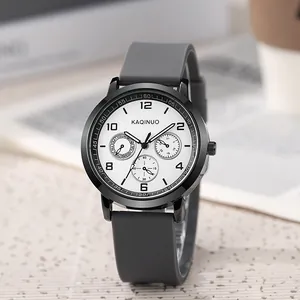 Macro detail of chronograph watch dial with sub-dials and soft silicone grey strap