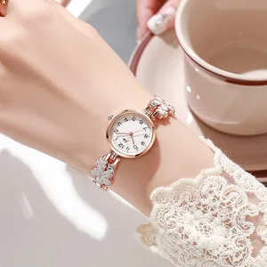 Elegant rose gold women's watch with flower petal bracelet and white dial